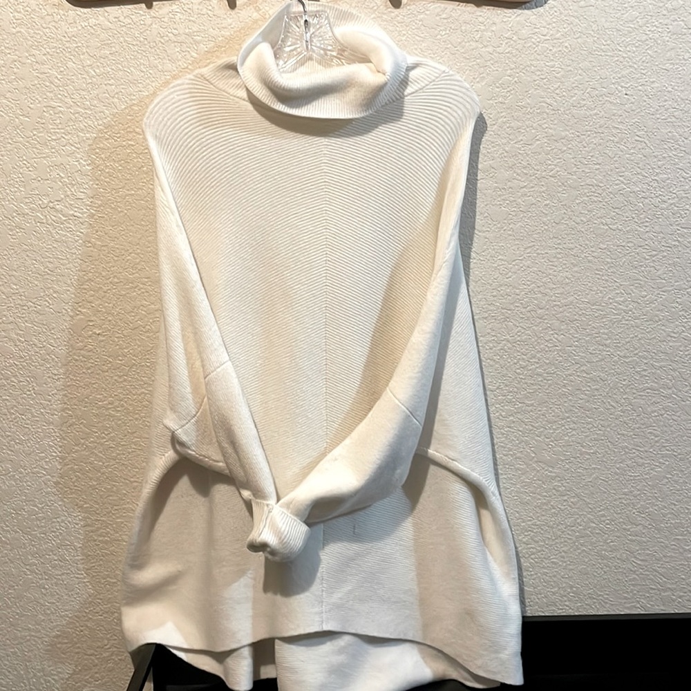 Amazon ivory all-seasons cowl neck sweater.
